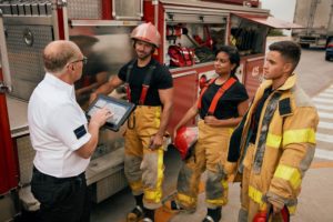 public safety - firefighters use enterprise tablet to undertand task